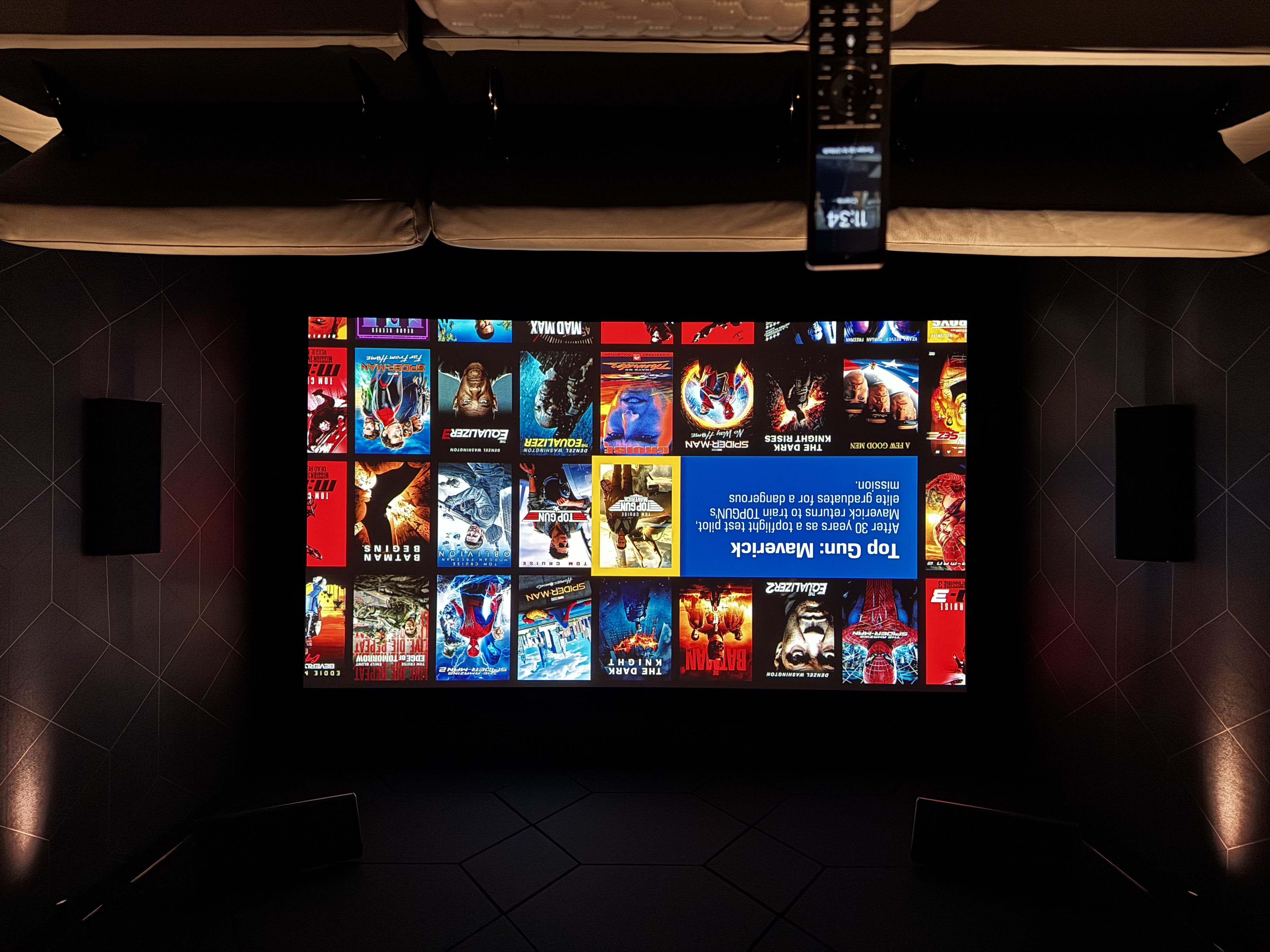 Dedicated home cinema room with custom acoustic panels and 4K laser projection